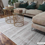 Corom Beige Area Rug - Clearance