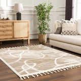 Living room scene with a cream sofa and the Azana Cream Area Rug featuring an abstract geometric design. Roomscene-Rectangle