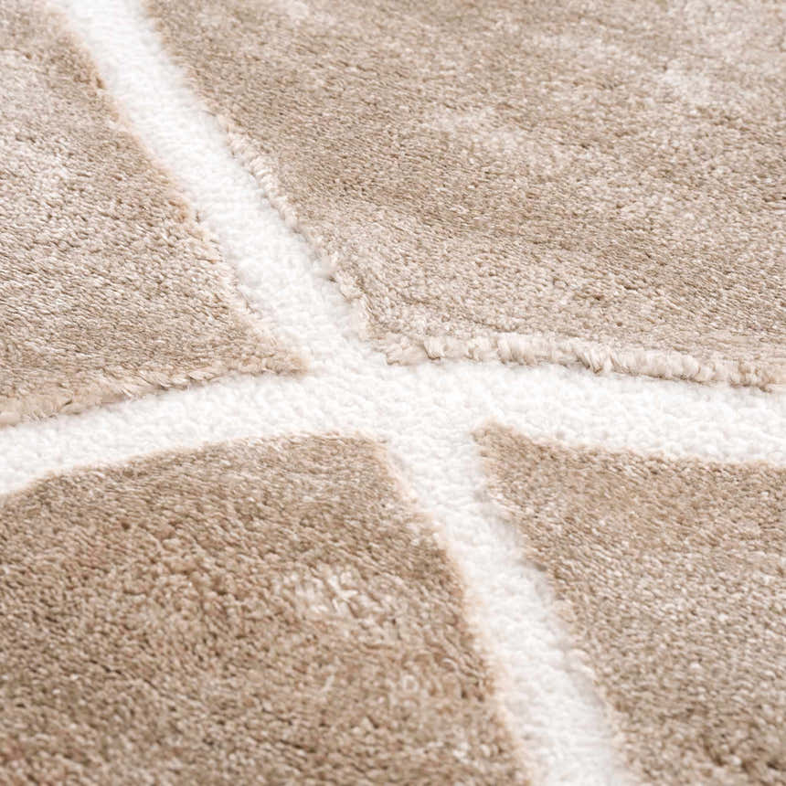 Close-up of the Azana Cream Area Rug showing the geometric pattern and soft, textured polypropylene material. Texture