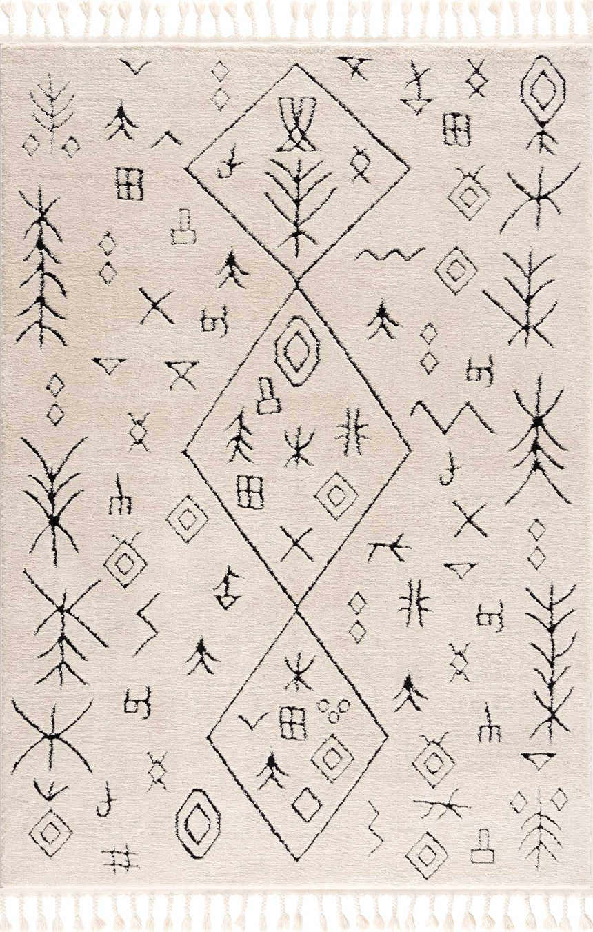 Close-up of the Thian Tribal Area Rug. Beige rug with black tribal-inspired geometric diamond and tree pattern. Tassels on the edges. Design-Rectangle-46