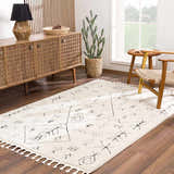 Living room scene with a beige Thian Tribal Area Rug, wooden cabinet, chair, and cactus. Farmhouse style. Roomscene-Rectangle