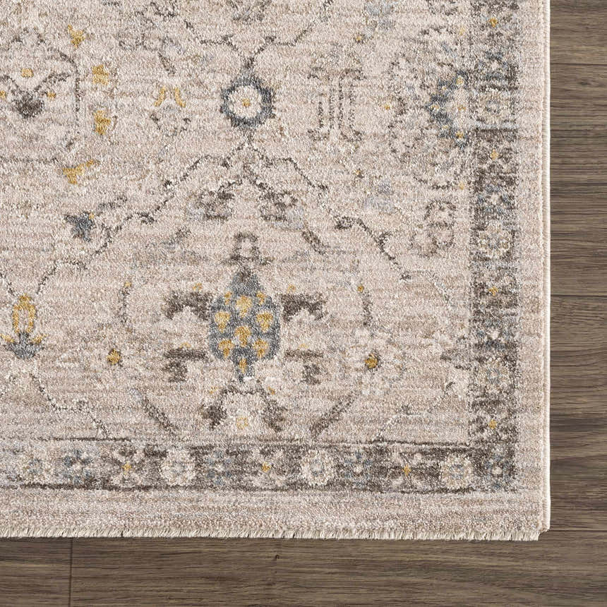 Close-up of the Annie Cream Textured Rug showing its farmhouse style pattern and soft, neutral colors on a wood floor. Swatch