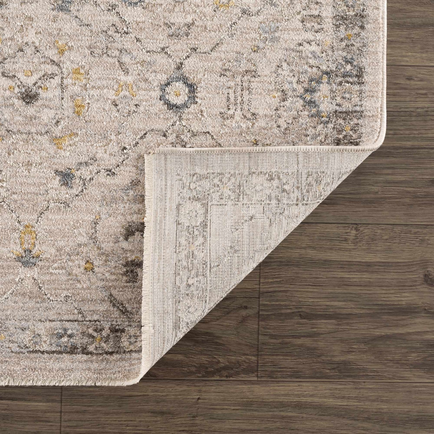 Close-up of Annie Cream Textured Rug showing cotton weave, traditional pattern, and color variations. Fold