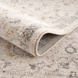 Close-up of Annie Cream Textured Rug showing its soft pile, floral pattern, and neutral colors. Fold