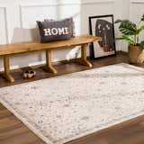 Entryway with Annie Cream Textured Rug, wood bench, floral art, and potted plant. Roomscene-Rectangle
