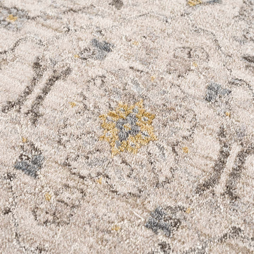 Close-up of the Annie Cream Textured Rug with floral design in cream, gray and gold tones. Texture