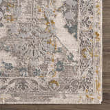 Close-up of the Alroy Textured Rug. Neutral grays, browns, and cream with subtle gold accents. Traditional floral pattern. Swatch