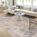Living room scene with a neutral sofa and Alroy Textured Rug in gray, brown, and gold tones. Roomscene-Rectangle
