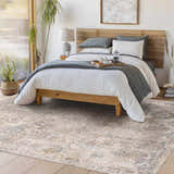 Bedroom scene with a light wood bed, and Alroy Textured Rug in gray, brown, and gold tones. Roomscene-Rectangle