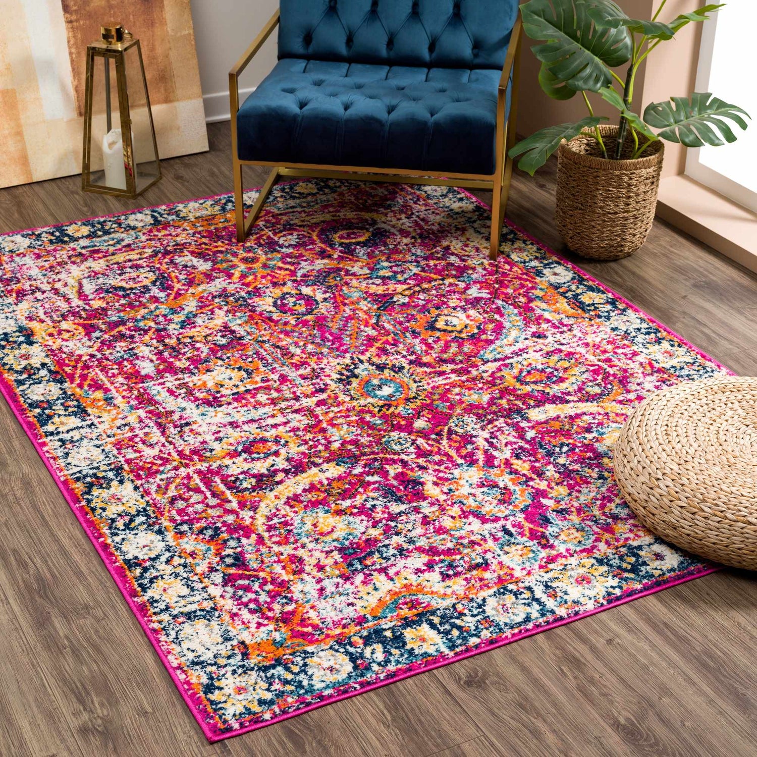 Living room scene with a vibrant New Vick Area Rug, blue chair, and monstera plant. Roomscene-Rectangle