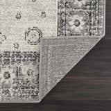 Close-up of the Marash 4605 Gray Area Carpet showing its gray, ivory, and silver gray contemporary pattern and machine-made construction. Fold