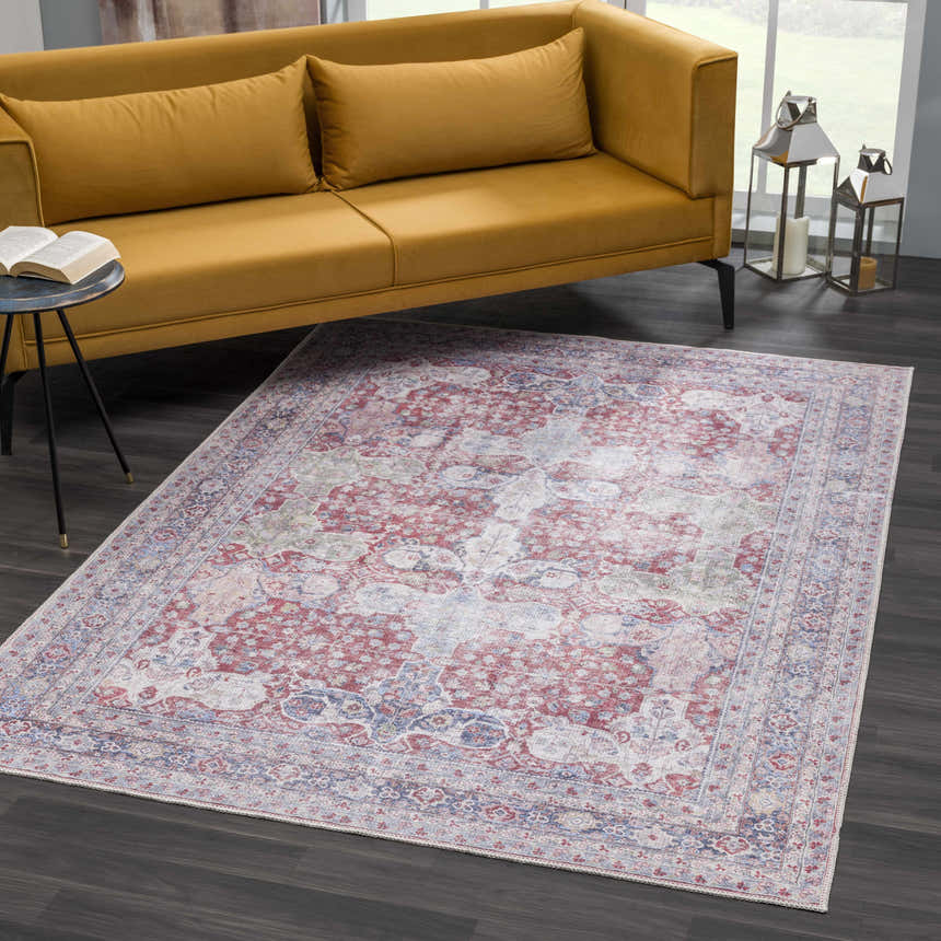 Living room scene with a Rust Goma Vintage Area Rug, mustard sofa, and dark wood floors. Roomscene-Rectangle