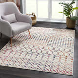 Living room scene with a Marash KMRSH-4600 area rug, off-white with colorful bohemian diamond pattern, under a chair. Roomscene-Rectangle