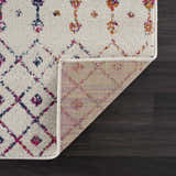 Close-up of the Marash KMRSH-4600 rug showing its off-white base with colorful bohemian diamond and floral pattern. Fold