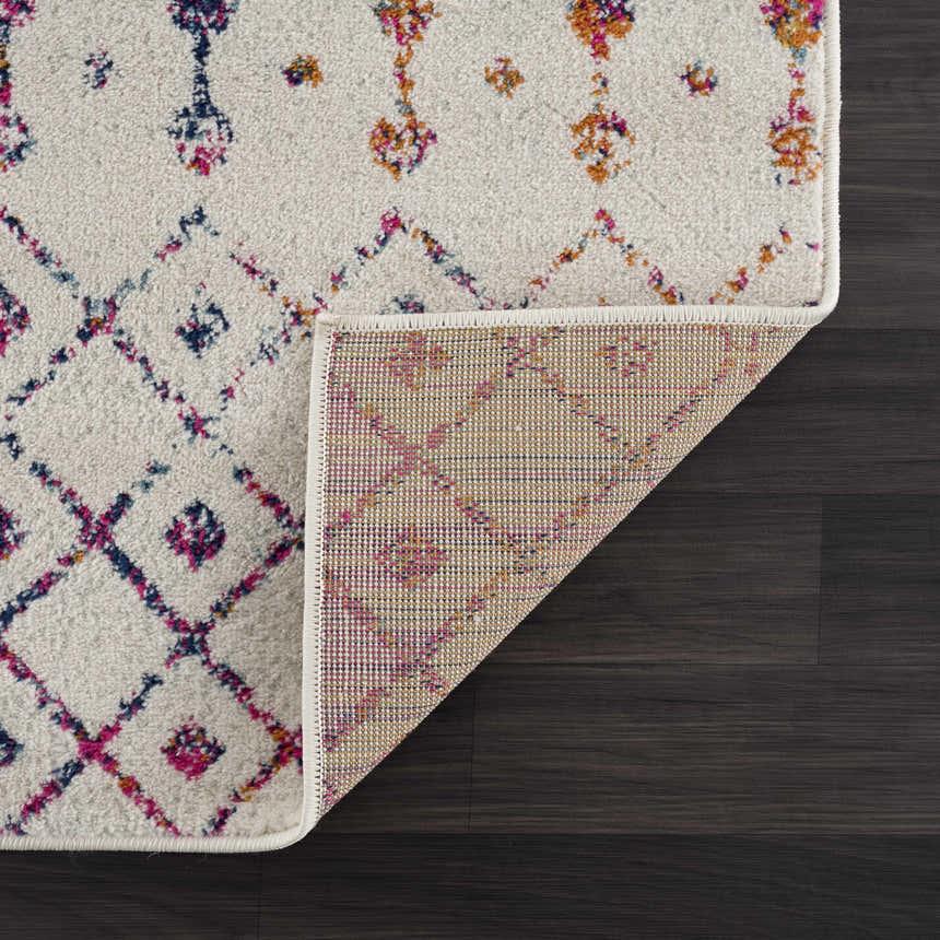 Close-up of the Marash KMRSH-4600 rug showing its off-white base with colorful bohemian diamond and floral pattern. Fold