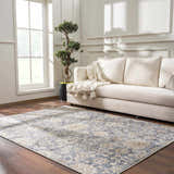 Living room scene with light gray Metin Area Rug, cream sofa, wood floors, and bright natural light. Roomscene-Rectangle