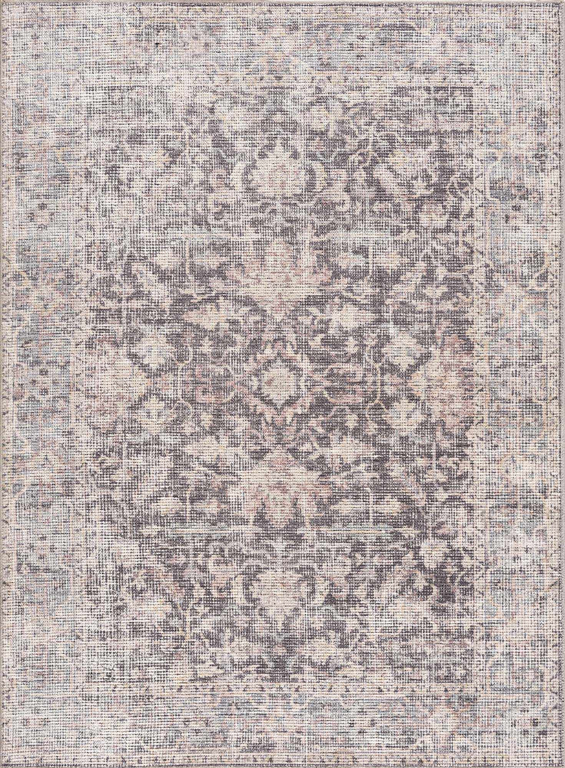 Close-up of the Nyota Area Rug. Traditional vintage style with gray, beige, and subtle floral patterns. Design-Rectangle-537