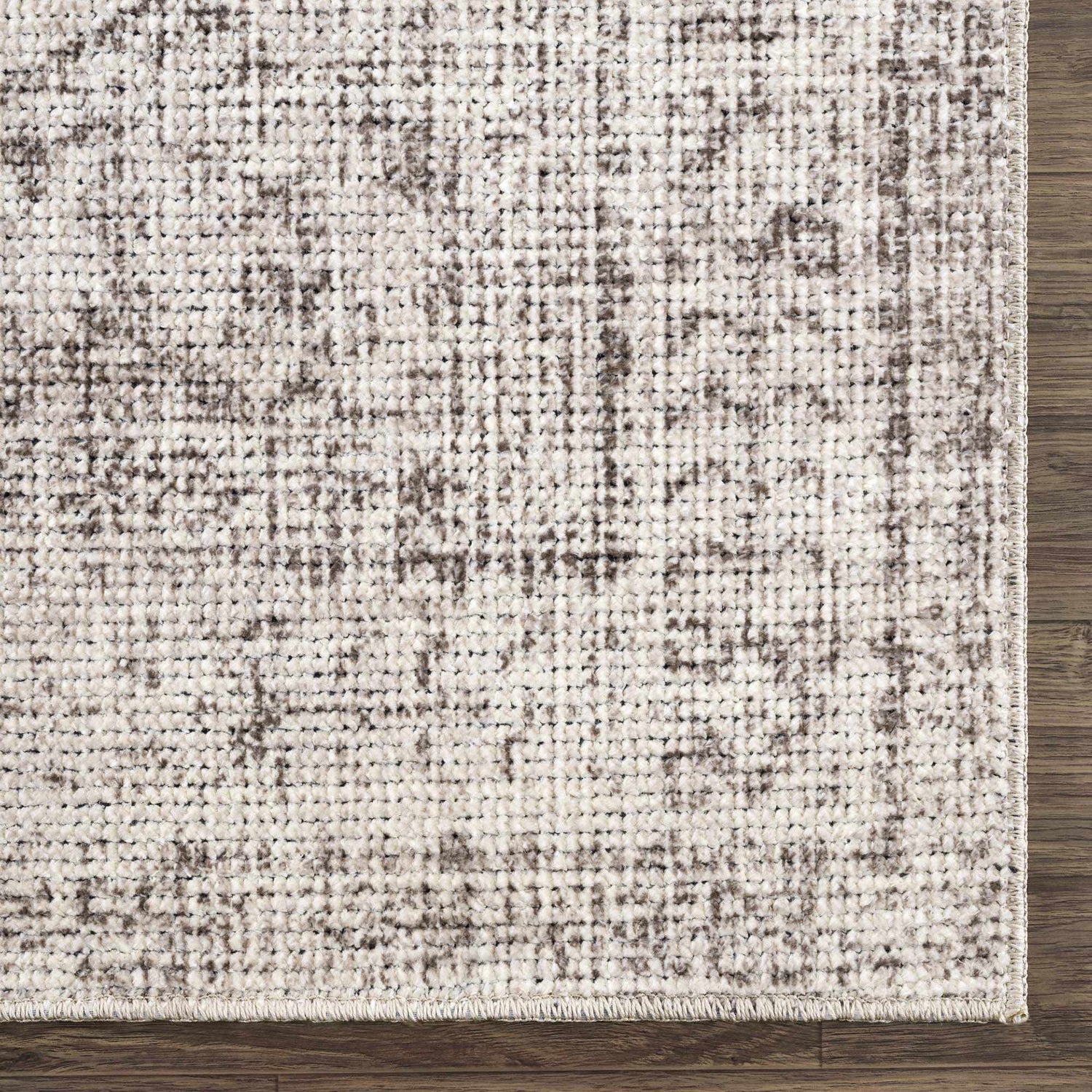 Close-up of the Mortye Cream & Brown Medallion Area Rug showing its woven texture and traditional vintage pattern. Swatch