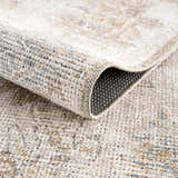 Close up of the Melor Area Rug showing its texture, weave, and backing. Fold