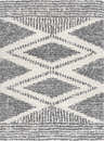 Close up of the Trunding Plush Area Rug. Charcoal and cream shag rug with a geometric diamond pattern. Design-Rectangle-5373