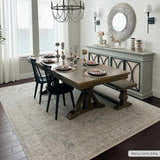 Farmhouse dining room with wood table, black chairs, and Deena Thick Luxe Area Rug in gray. Roomscene-Rectangle