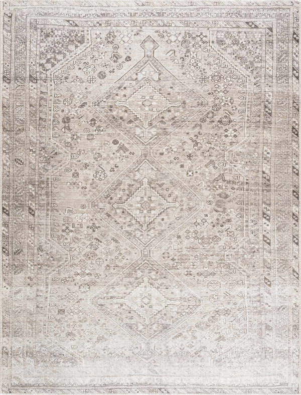 Close-up of the Nadie Area Rug in dark and medium gray. Machine-woven polyester rug with a traditional diamond pattern. Design-Rectangle-537