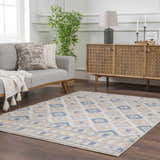 Living room scene with gray sofa and Eivin Pink & Blue Area Rug. Bohemian rug with light blue and gray diamond pattern. Roomscene-Rectangle