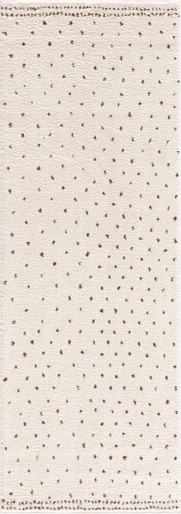Close-up of the Julie Ivory & Brown Area Rug. Features a beige base with small brown floral-like accents. Farmhouse style. Design-Runner-2773