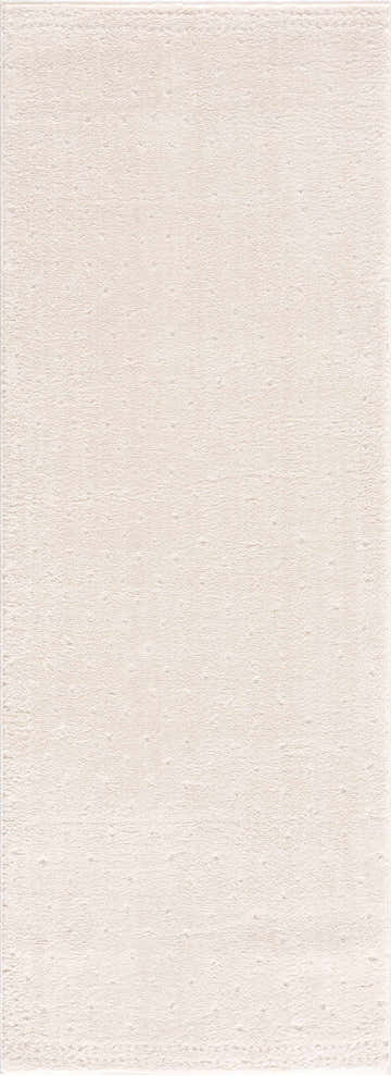 Close-up of the Julie Ivory Area Rug showing its soft, textured weave and subtle ivory color. Design-Runner-2773