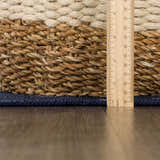 Close-up of the Milne Navy Dinosaur Washable Kids Rug showing texture and thickness with ruler for scale. Pile