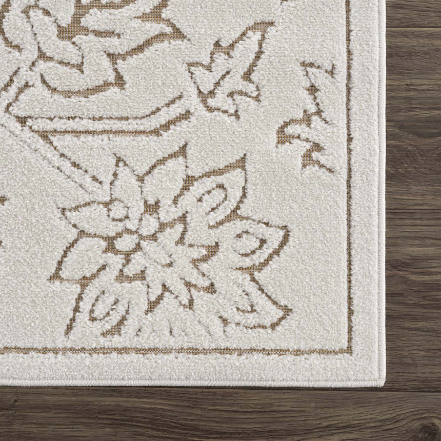 Close-up of the Tabuan 3D Outdoor Area Rug. Floral pattern in nutmeg on a white thatch background. Polypropylene rug on wood floor. Swatch