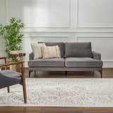 Living room scene with gray sofa and Tabuan 3D Outdoor Area Rug in white thatch, light peach, and nutmeg. Roomscene-Rectangle