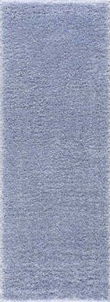 Close-up of the Faina Solid Aqua Shag Washable Area Rug, showing its soft, plush texture and light blue color. Design-Runner