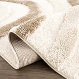 Close up of the Espiye Area Rug showing its driftwood and white shag texture and machine woven backing. Fold