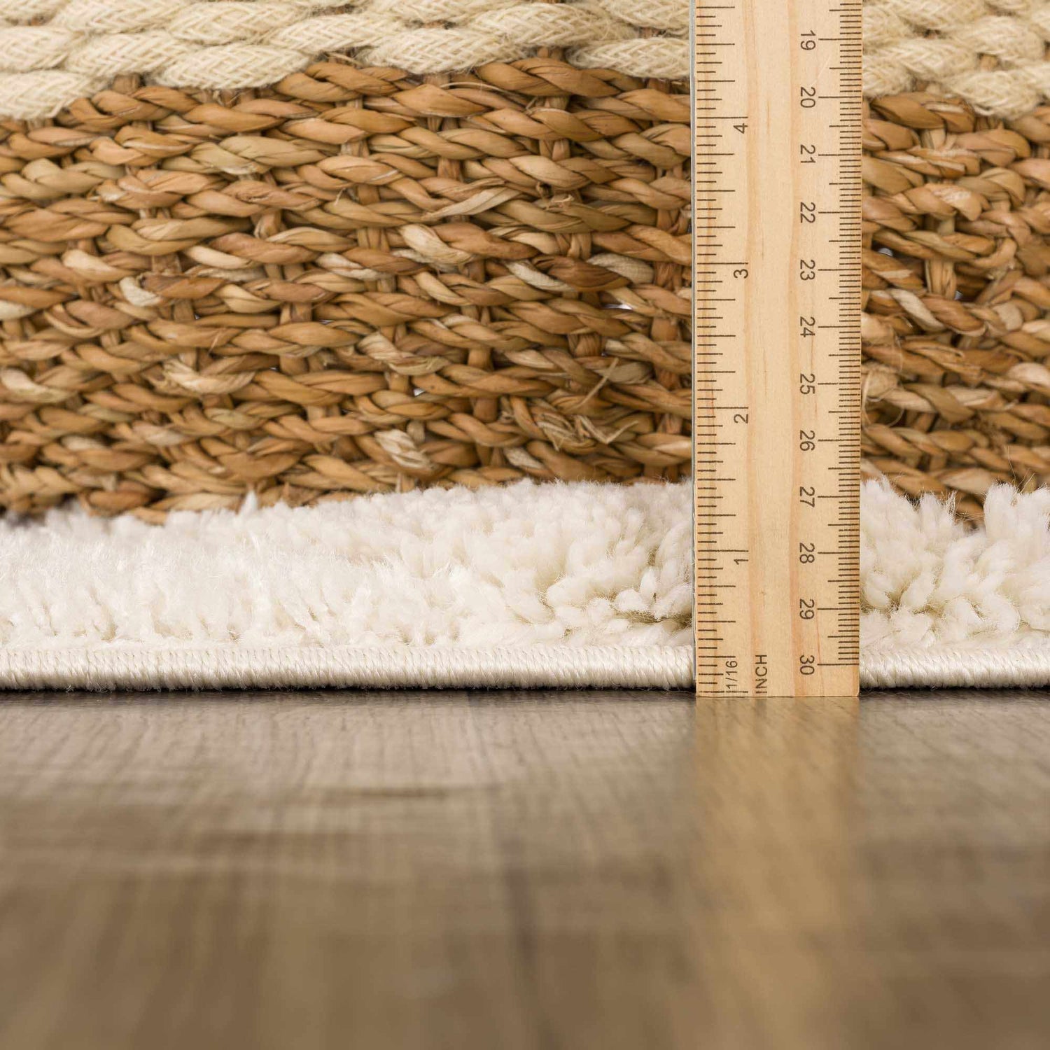 Close-up of the Espiye Area Rug showing the shag texture and pile height with a ruler for scale. Pile