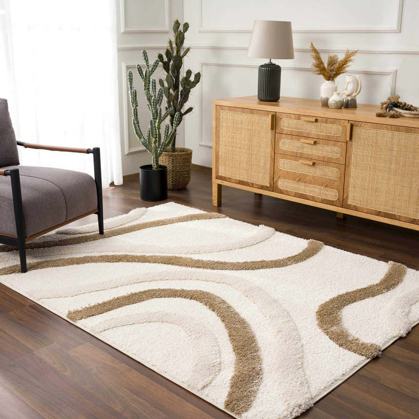 Living room scene with a driftwood Espiye Area Rug, gray chair, and wood cabinet. Roomscene-Rectangle