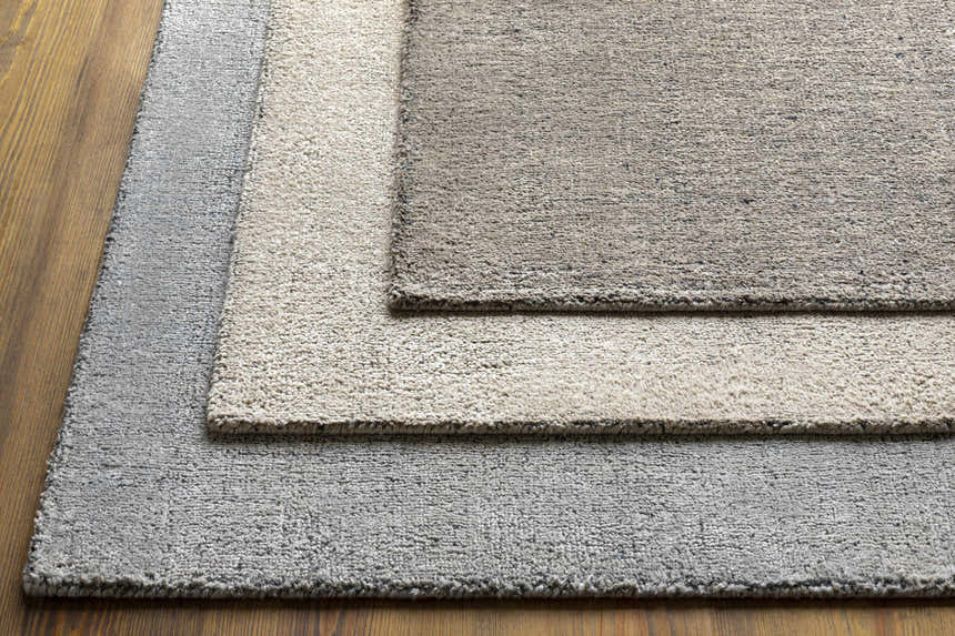 Close up of Phalaborwa Area Rug in gray, light beige, and tan, showing wool and viscose texture. Styleshot