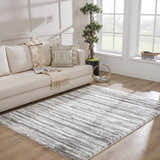 Living room scene with a gray and white Lotta Area Rug, beige sofa, and natural light. Roomscene-Rectangle
