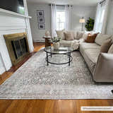 Living room with a gray Hedda Boutique Washable Rug, cream sectional, glass coffee table, and fireplace. Roomscene-Rectangle