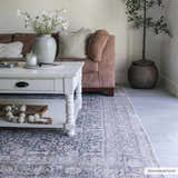 Living room scene with a gray and nutmeg Hedda Boutique Washable Rug, white coffee table, and brown sofa. Roomscene-Rectangle