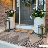 Stylish front porch featuring the Ijlal Washable Area Rug in camel and dark brown with geometric pattern. Roomscene-Rectangle