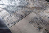Close-up of Midfield Luxe Rug samples in charcoal, cream, and gray. Contemporary rug designs and textures. Styleshot