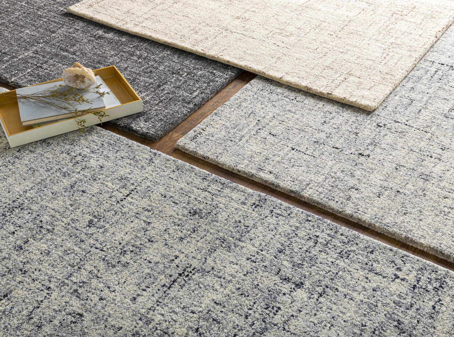 Close-up of Tanana Area Rug in black, cream, and gray wool. Hand-tufted contemporary design with subtle texture. Styleshot