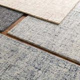 Close-up of Tanana Area Rug showing texture and colors: black, cream, gray. Hand-tufted 100% wool rug. Styleshot