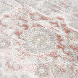 Close-up of the Damla Area Rug showing its plush texture and vintage-inspired pink and gray floral pattern. Texture