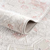 Close-up of the Calum Pink Floral Thick Area Rug showing its plush texture and traditional floral pattern. Fold