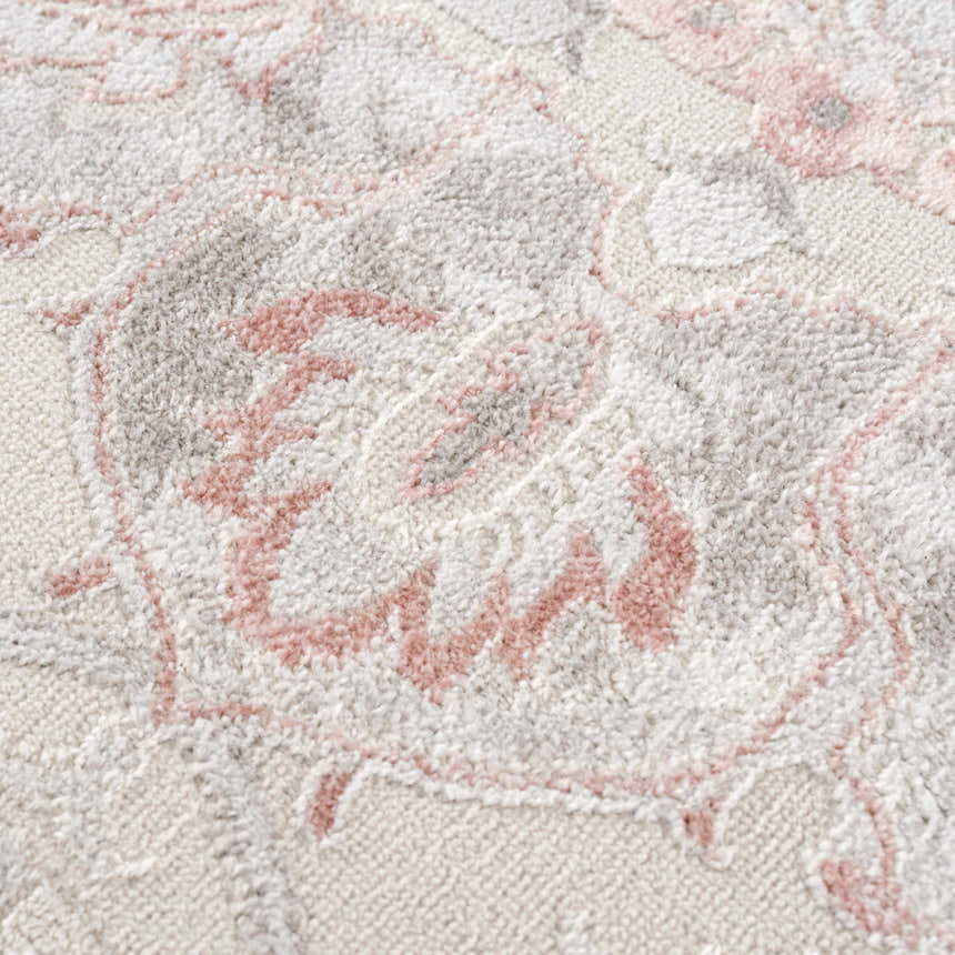 Close-up of the Calum Pink Floral Area Rug showing the texture and floral pattern in gray and pink. Texture