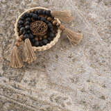 Close-up of Gael Boutique Washable Rug showing its tan, olive, and light blue vintage pattern and soft texture. Styleshot