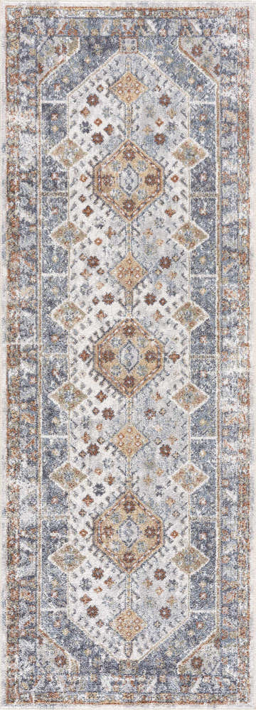 Close-up of the Afya Boutique Washable Rug. Features a traditional diamond pattern in beige, dark blue, and rust hues. Design-Runner-2710