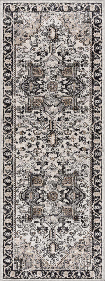 Close-up of the Cabacungan Washable Area Rug. Bohemian style rug in black, gray, light beige, and taupe. Traditional vintage pattern. Design-Runner-2710